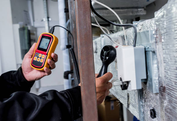 istock Technician use hand-held anemometer measuring air flowing measurement, wind speed and pressure. 1184933272