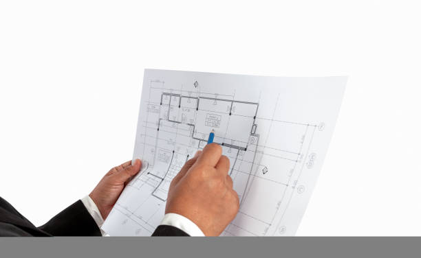 istock Businessman in the hand have a construction plan or architectural plan, Used for related professional house trading, real estate, construction. 1184933290