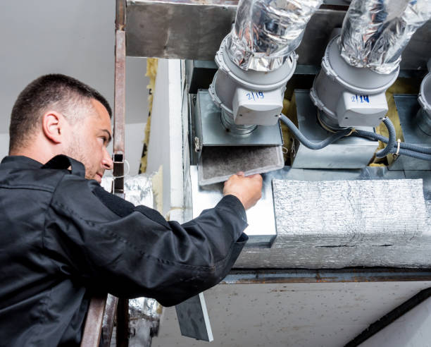 istock Ventilation cleaning. Specialist at work. Repair ventilation system (HVAC) 1184933424