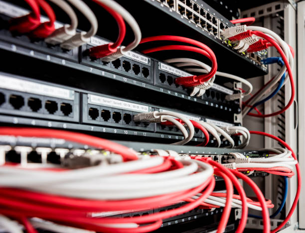 istock Network switch and ethernet cables in red and white colors. Data Center 1184935205