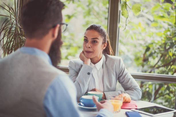 istock Business meeting over breakfast in the park 1184935471