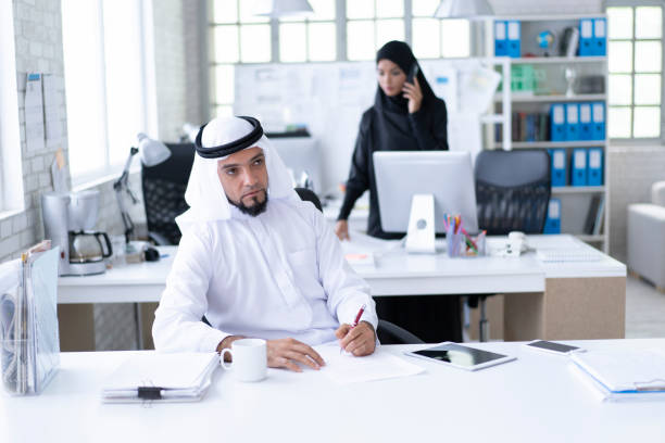 istock Serious arab businessman working in modern office 1184935523
