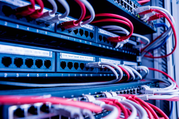 istock Network switch and ethernet cables in red and white colors. Data Center 1184936288