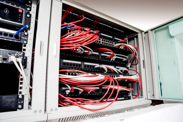 istock Network switch and ethernet cables in red and white colors. Data Center 1184936371