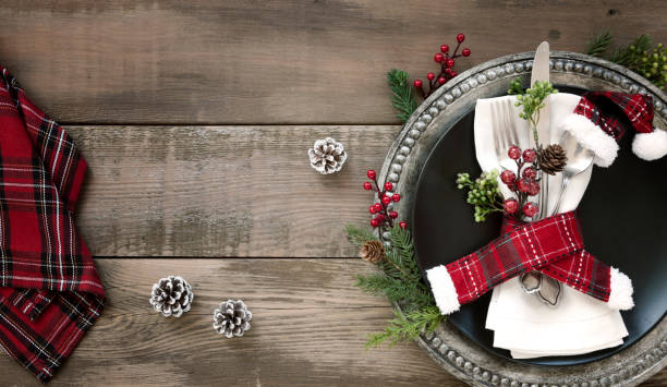 istock Christmas Dining Plate and Napkin on an Old Wood Table 1184936413