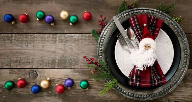 istock Christmas Dining Plate and Napkin on an Old Wood Table 1184936424