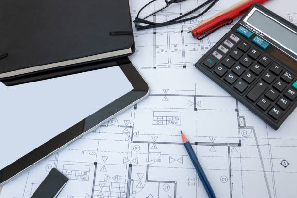 istock architect design working drawing sketch plans blueprints in architect studio 1184936460