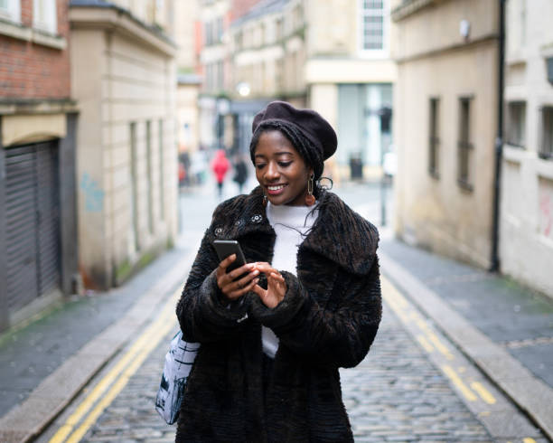 istock Young Woman using Mobile Phone 1184937368