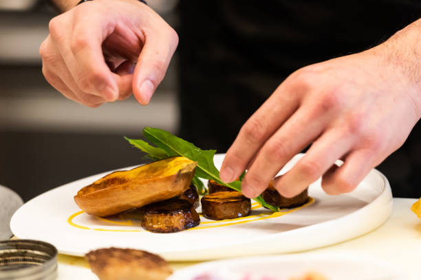 istock Chef Preparing gourmet food 1184939433