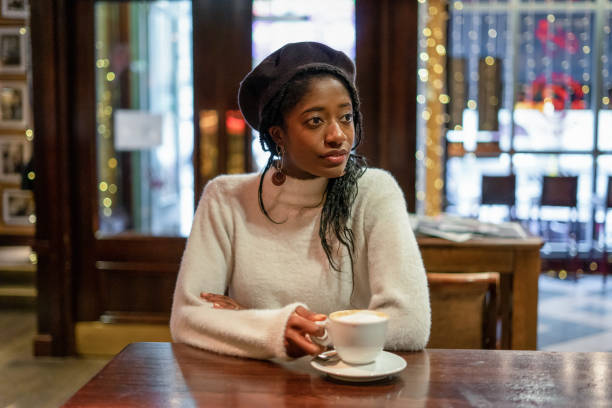 istock Young Woman Drinking Coffee 1184940283