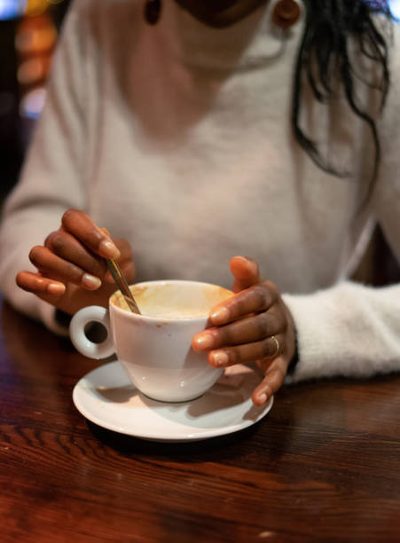 istock Young Woman Drinking Coffee 1184940859