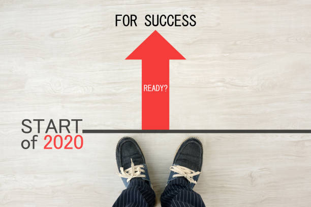 istock Man standing on starting line of 2020 1184943464