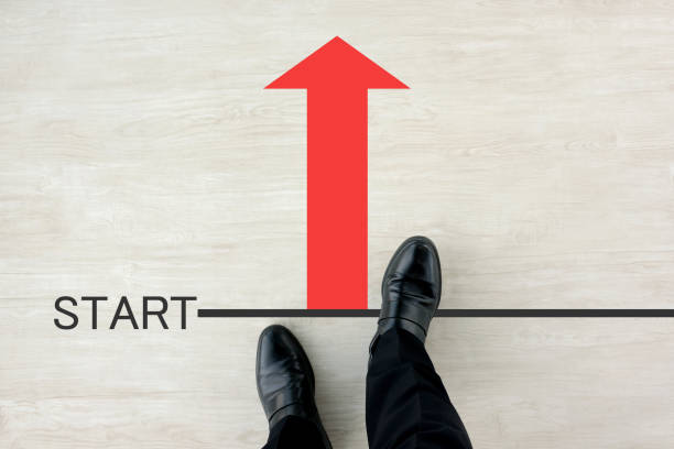 istock Business man standing on starting line 1184943583