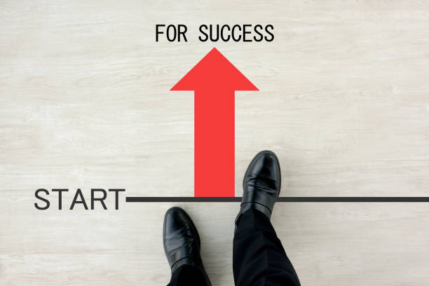 istock Business man standing on starting line 1184943585