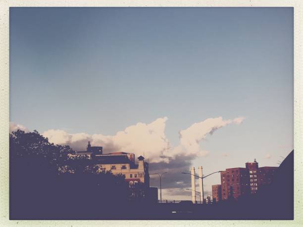 istock Sky, Couds, Smoke Stacks and Buildings 1184945923