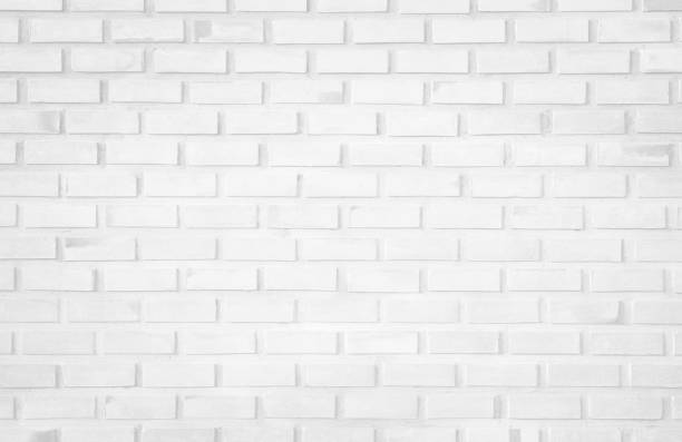istock Wall white brick wall texture background in room at subway. Brickwork stonework interior, rock old clean concrete grid uneven abstract weathered bricks tile design, horizontal architecture wallpaper. 1184948676