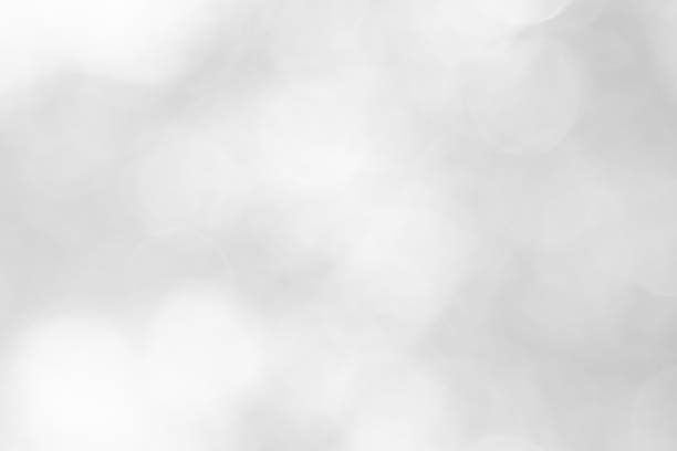 istock Abstract white bokeh with soft blurred background nature blurry light party in vintage style warm shimmering and faded colorful defocused circular modern. Gray silver shiny copy space for holiday. 1184951215