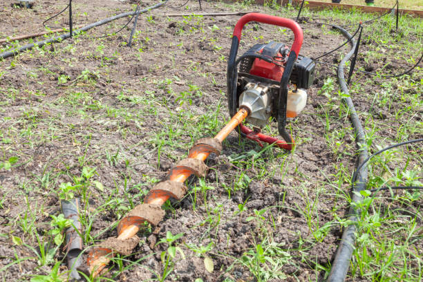 istock manual drilling hole machine on the ground at sunny day 1184957914