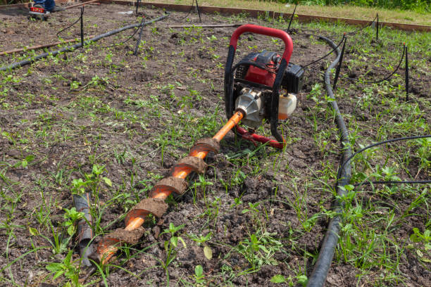 istock manual drilling hole machine on the ground at sunny day 1184957974