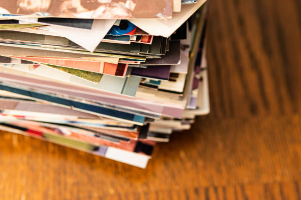 istock Stack of old photo prints and Memories to be digitized a 1184958900