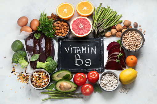 Foods high in vitamin B9. Healthy food, sources of folic acid. Top view with copy space