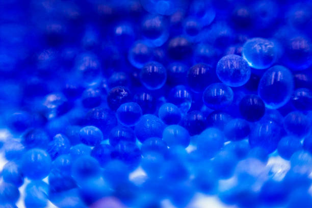 istock Blue silica gel adsorbs moisture from the air, preventing damage. 1184964523