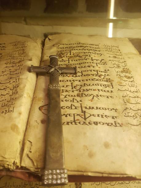 istock Old Bible and Wooden Cross 1184965426