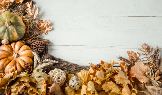 istock Autumn background with decorative items and pumpkin. 1184970154