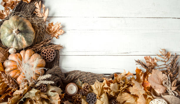istock Autumn background with decorative items and pumpkin. 1184970162