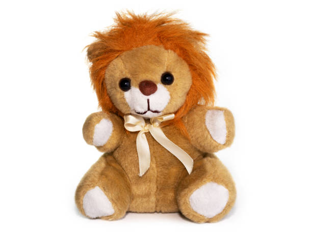 istock lion plush toy on white background. 1184970269