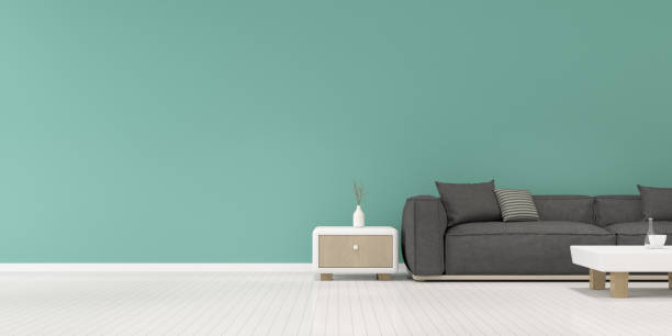 istock Perspective of modern luxury living room with dark fabrics sofa and side table on plain wall background,green, Minimal. - 3D rendering. 1184971221
