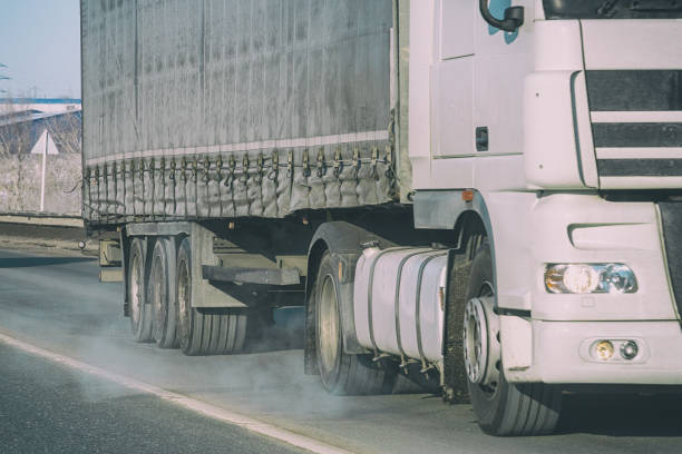 istock Big Truck rides on the road 1184971262
