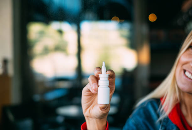 Young Woman Holding Nasal Spray