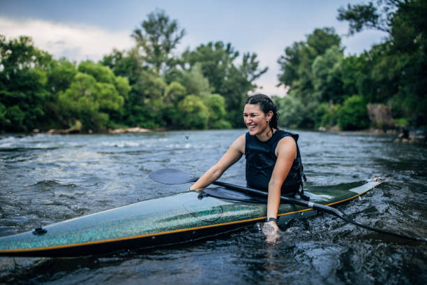 istock Beautiful  woman kayaking 1184981847