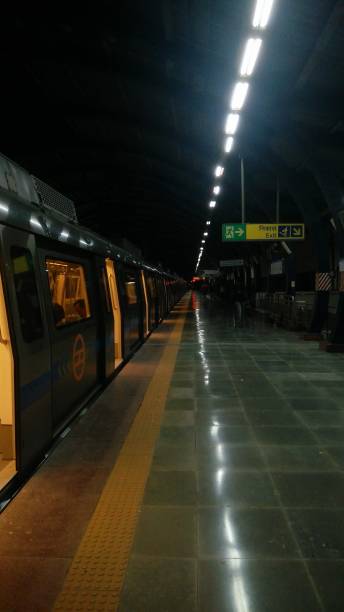 Delhi Metro At Night The Metro Station in Dwarka , Delhi has a separate charm in night delhi metro stock pictures, royalty-free photos & images