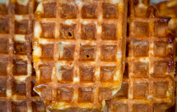 istock Homemade Belgian waffles with honey background 1184983652