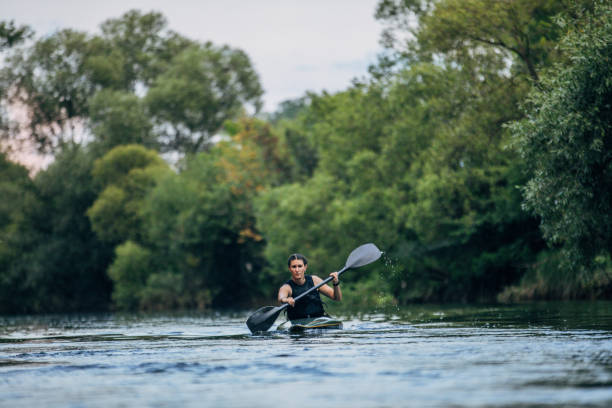 istock Young woman kayaking 1184983702