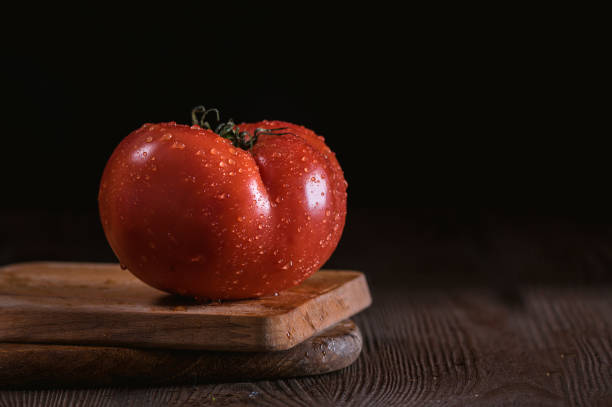 istock Close up macro image of a red ripe tomato 1184984814