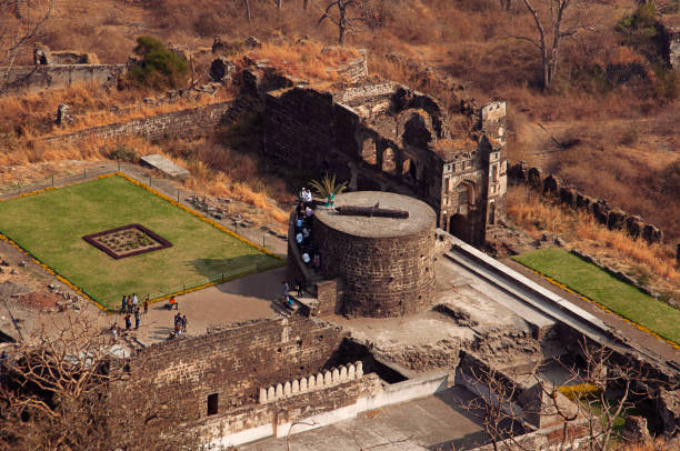 AURANGABAD, MAHARASHTRA, February 2019, Tourist at Daulatabad fort with visible building structure and canon AURANGABAD, MAHARASHTRA, February 2019, Tourist at Daulatabad fort with visible building structure and canon aurangabad maharashtra photos stock pictures, royalty-free photos & images