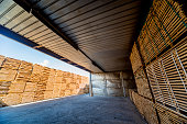 istock Lumber ready for loading into a dry kiln. Wood drying in containers 1184985296