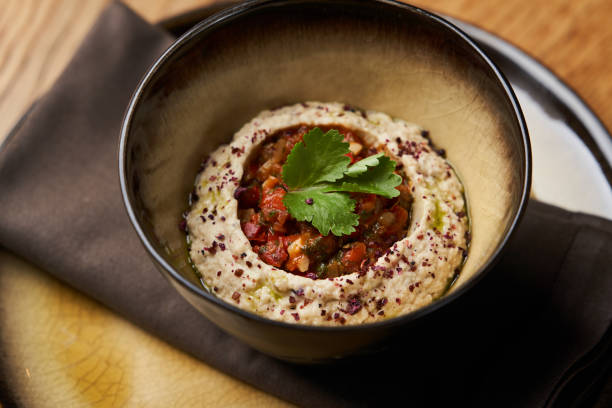 istock Baba ganoush hummus with eggplant on wooden table background. 1184988545