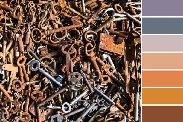 Color matching palette from close-up flat lay background image of old rusty keys from many different locks
