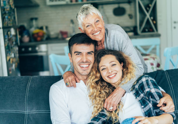 Family Portrait of happy Young couple and old grandmother mother in law stock pictures, royalty-free photos & images