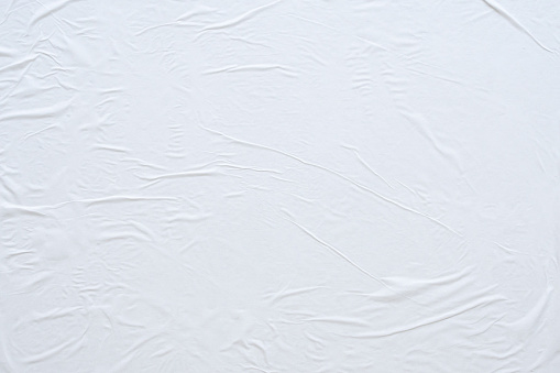 Fondo de textura de póster de papel arrugado y arrugado blanco en blanco photo