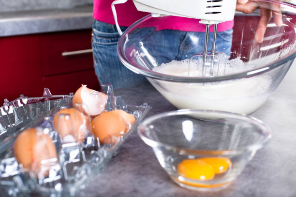 istock woman whipping egg whites 1184999875