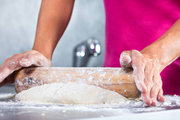istock woman preparing a pie dough 1185000651