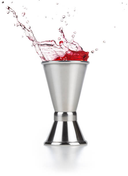 istock red liqueur splashing out of a jigger 1185002404