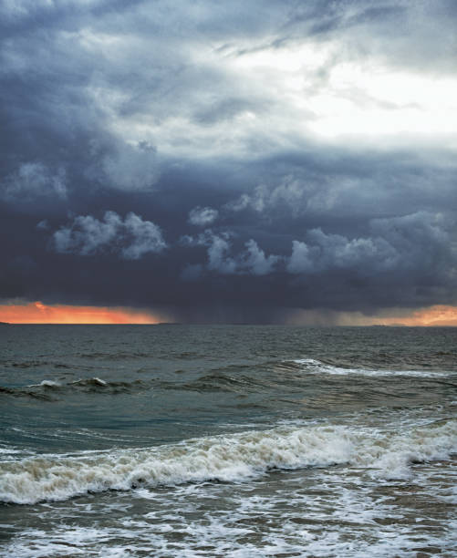 big strome and raining  in the sea