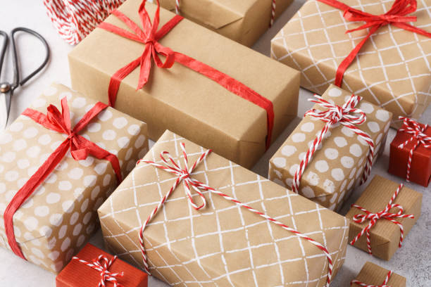 istock Paper wrapped gift boxes decorated with red ribbon and twine. 1185004861