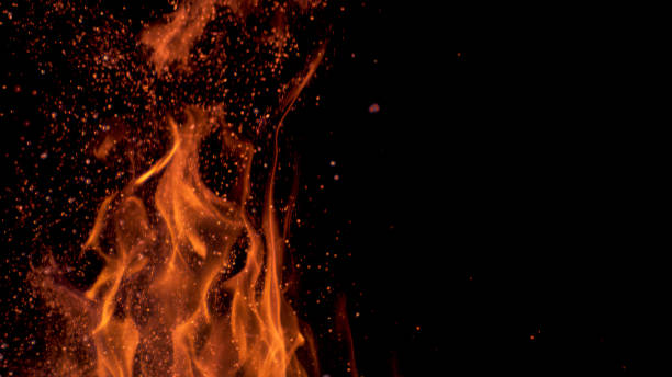 istock MACRO: Bright bonfire burning intensely on a calm summer evening in the wild. 1185005605